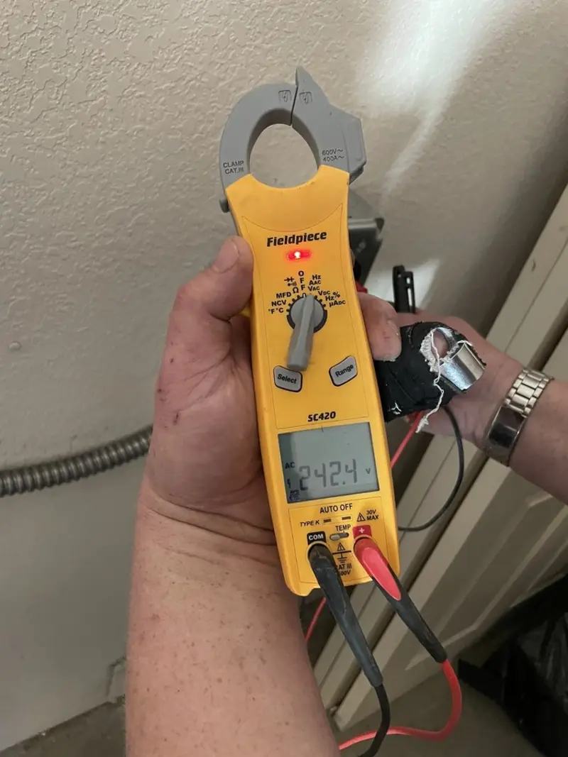 Voltage testing with clamp meter during Recessed Lighting Installation in Hastings